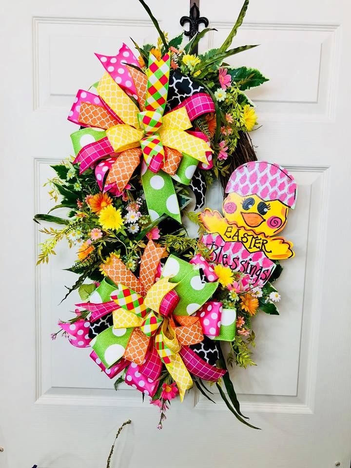 grapevine wreath with easter chick sign and pink and yellow bow