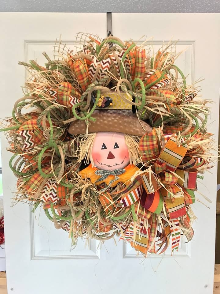 fall themed wreath with a cute scarecrow head