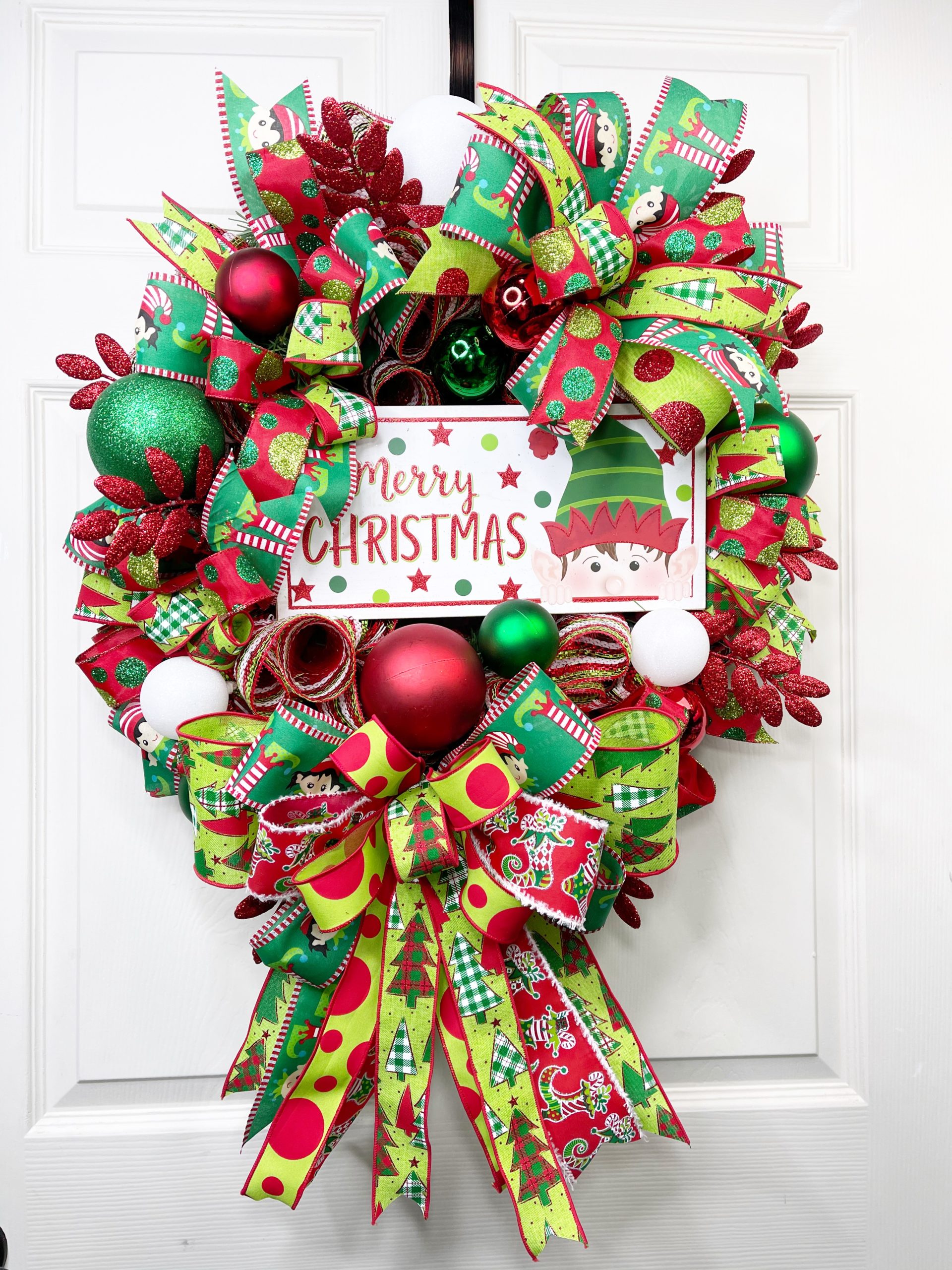 Red and Green wreath with Merry Christmas sign