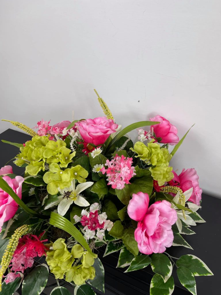 pink and white floral grave saddle 