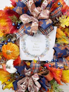 Wreath with fall leaves and a sign