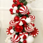 small fake christmas tree with decorative peppermint candy
