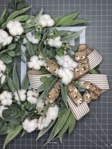 wreath with cotton, greenery, and bow
