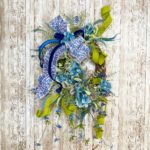 grapevine with greenery and blue florals and ribbon