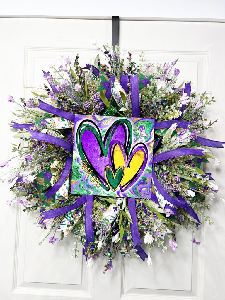 Floral Mardi Gras wreath with heart sign 
